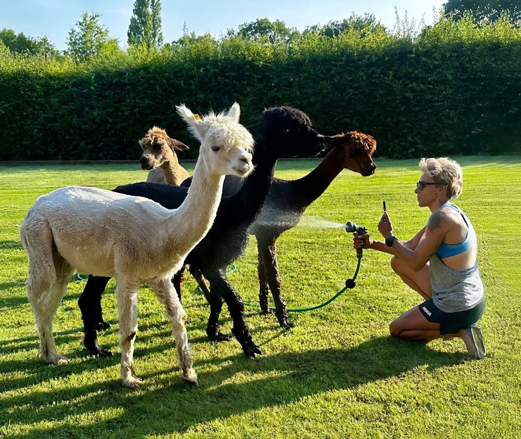 Kelly Holmes poses with her alpacas