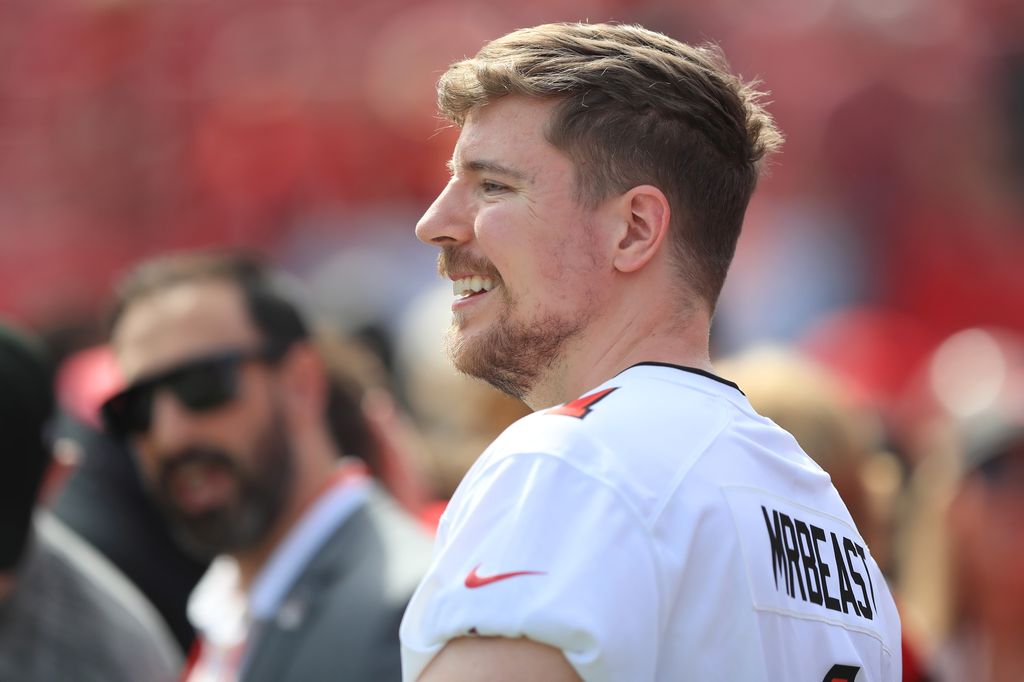 MrBeast enjoys time on the field before the regular season game between the Atlanta Falcons and the Tampa Bay Buccaneers