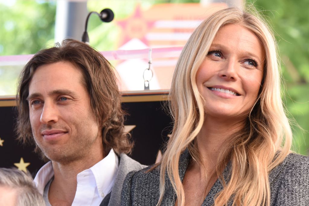 Actor Gwyneth Paltrow (R) and producer Brad Falchuk (L) attend the Hollywood Walk of Fame star unveiling ceremony for producer/director Ryan Murphy, December 4, 2018 in Hollywood, California. (Photo by Robyn Beck / AFP)        (Photo credit should read ROBYN BECK/AFP via Getty Images)