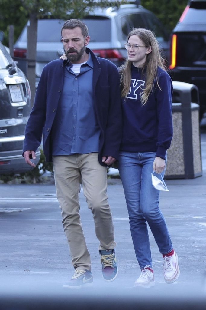 Ben Affleck takes a walk with his daughter Violet, who bears a striking resemblance to her mother, Jennifer Garner. Violet walks with her arm around her dad, and the two appear to share a close bond.