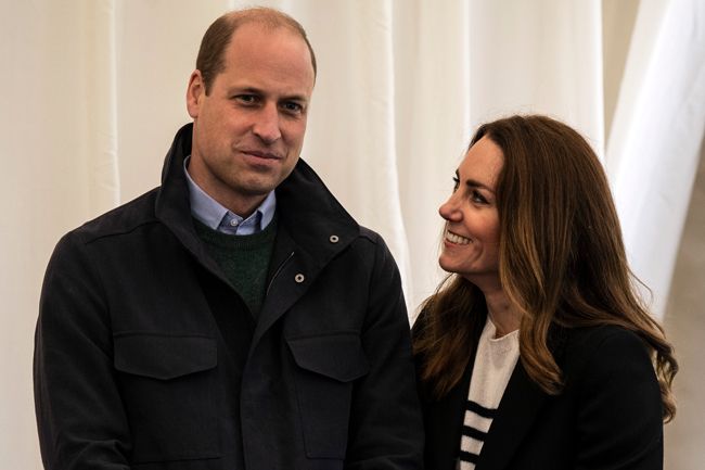Kate Middleton gazing at Prince William indoors