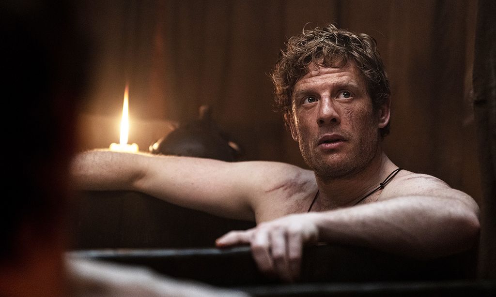 man sitting in bath tub