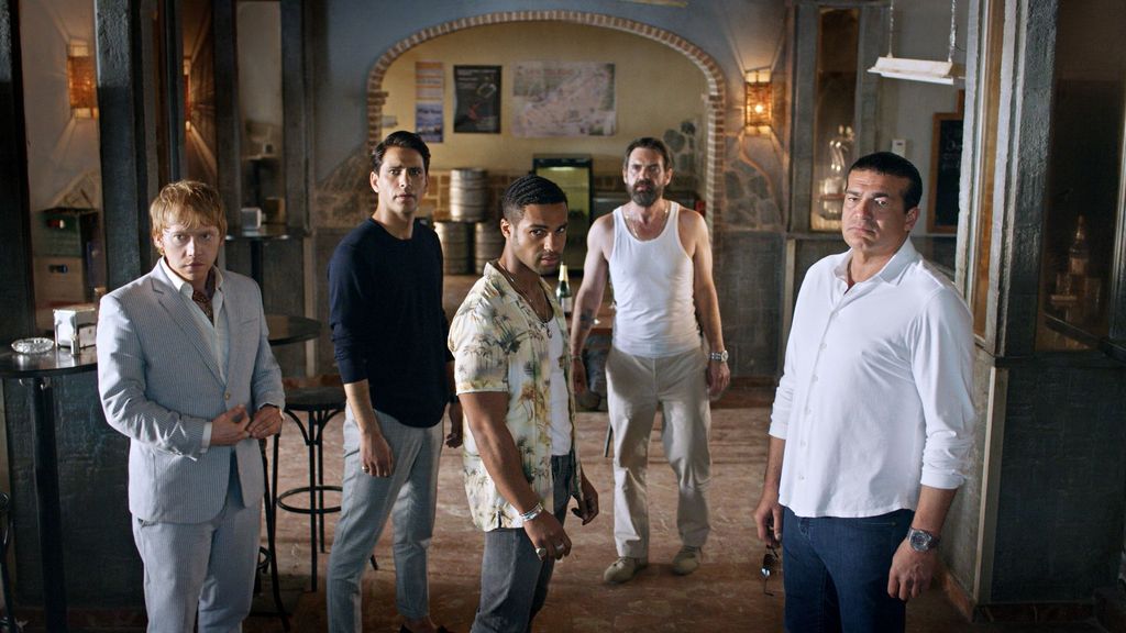 group of men standing in house