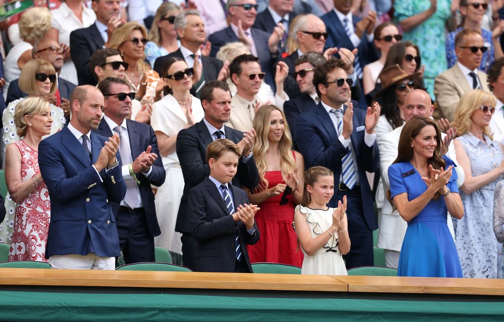 Prince William, Prince of Wales, Prince George of Wales, Princess Charlotte of Wales and Catherine, Princess of Wales applaud from the Royal Box 