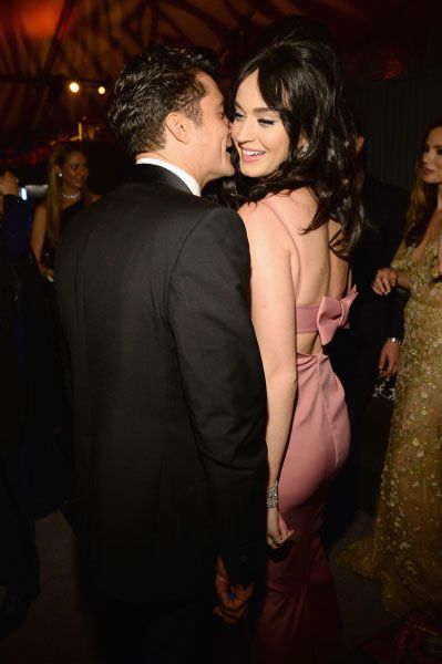Orlando Bloom kissing Katy Perry on a red carpet