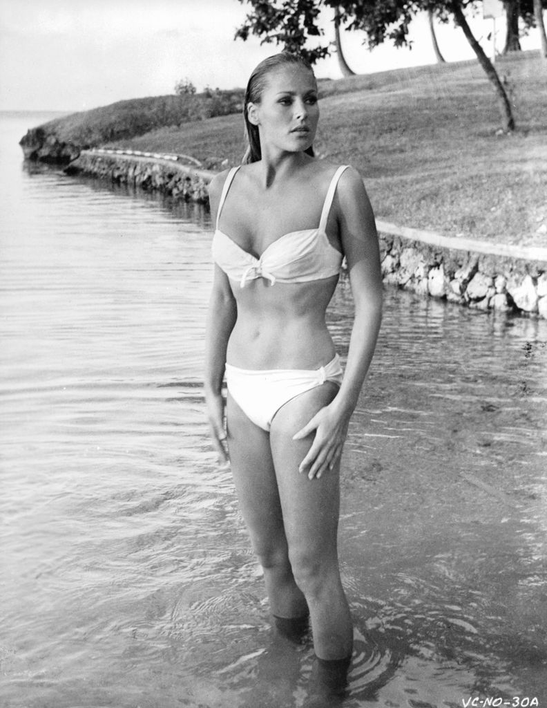 Ursula Andress standing in the water wearing a bikini in a scene from the film 'James Bond: Dr. No', 1962