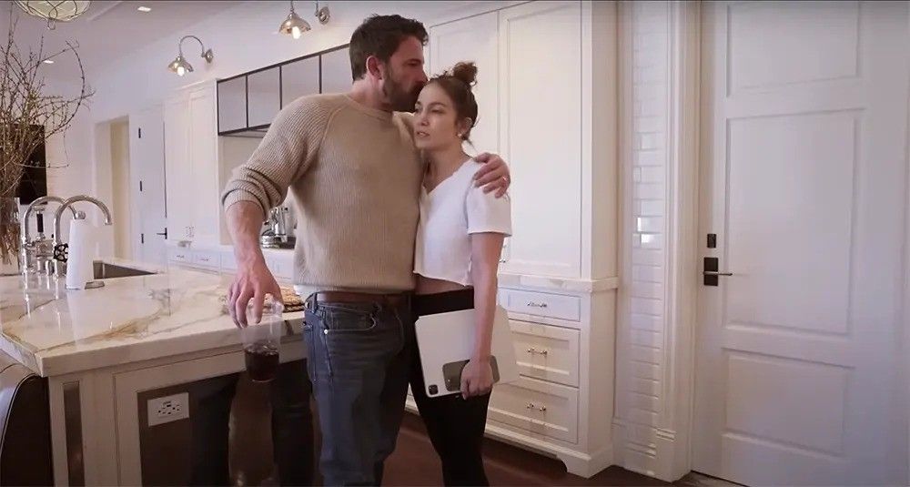 ben affleck and jennifer lopez hugging inside kitchen of former marital home