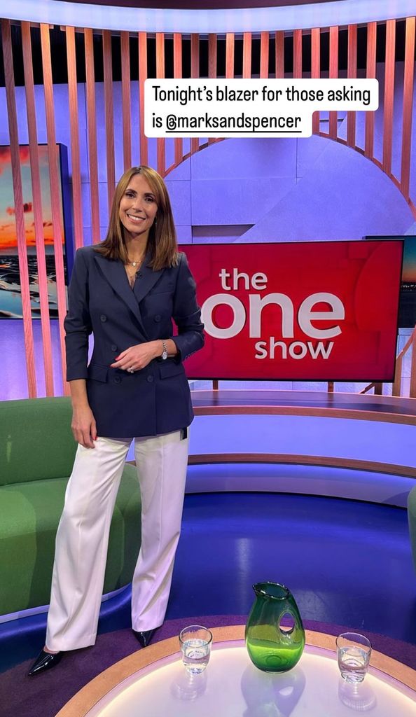 Alex Jones wearing a navy blue blazer from Marks & Spencer