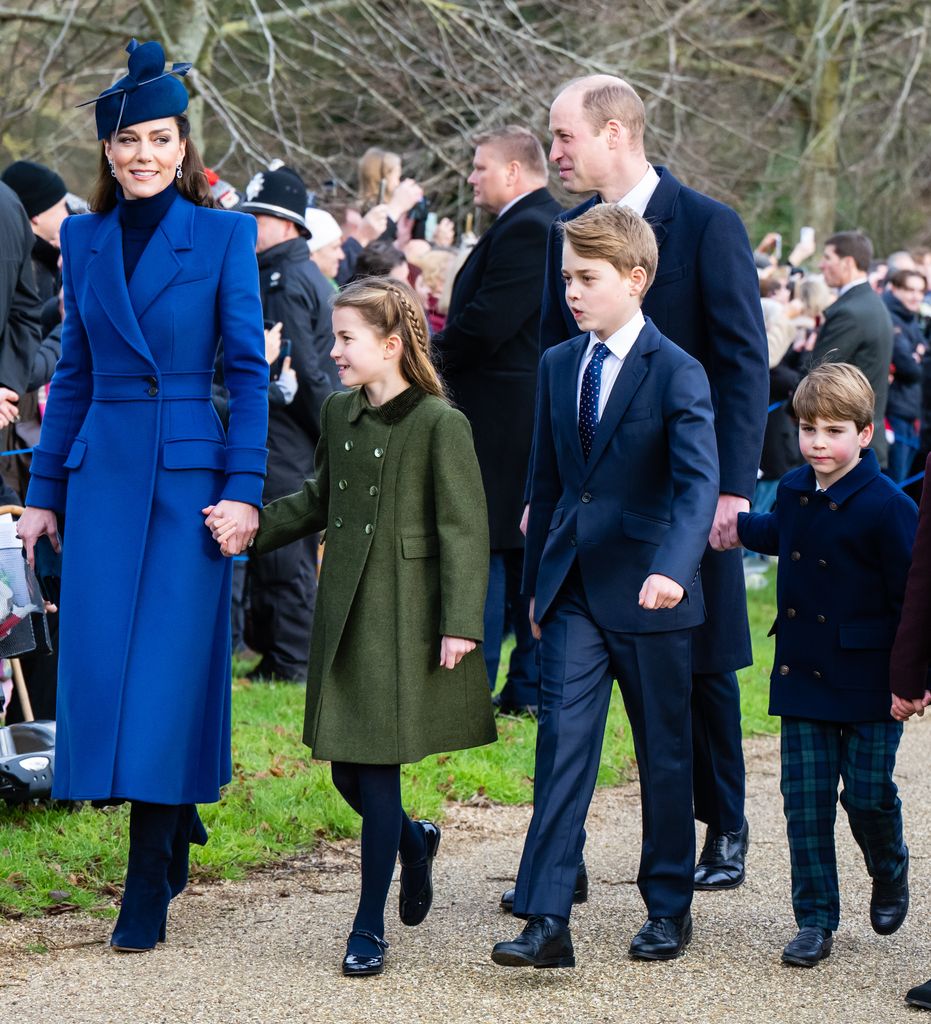 Catherine, Princess of Wales, Princess Charlotte of Wales, Prince George of Wales, Prince William, Prince of Wales, Prince Louis of Wales walking holding hands in coats