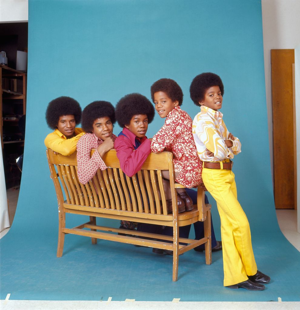 R&B quintet "Jackson Five" pose for a studio portrait sitting on a bench in circa 1972 in Los Angeles, California. L-R: Tito Jackson, Jackie Jackson, Jermaine Jackson, Marlon Jackson, Michael Jackson