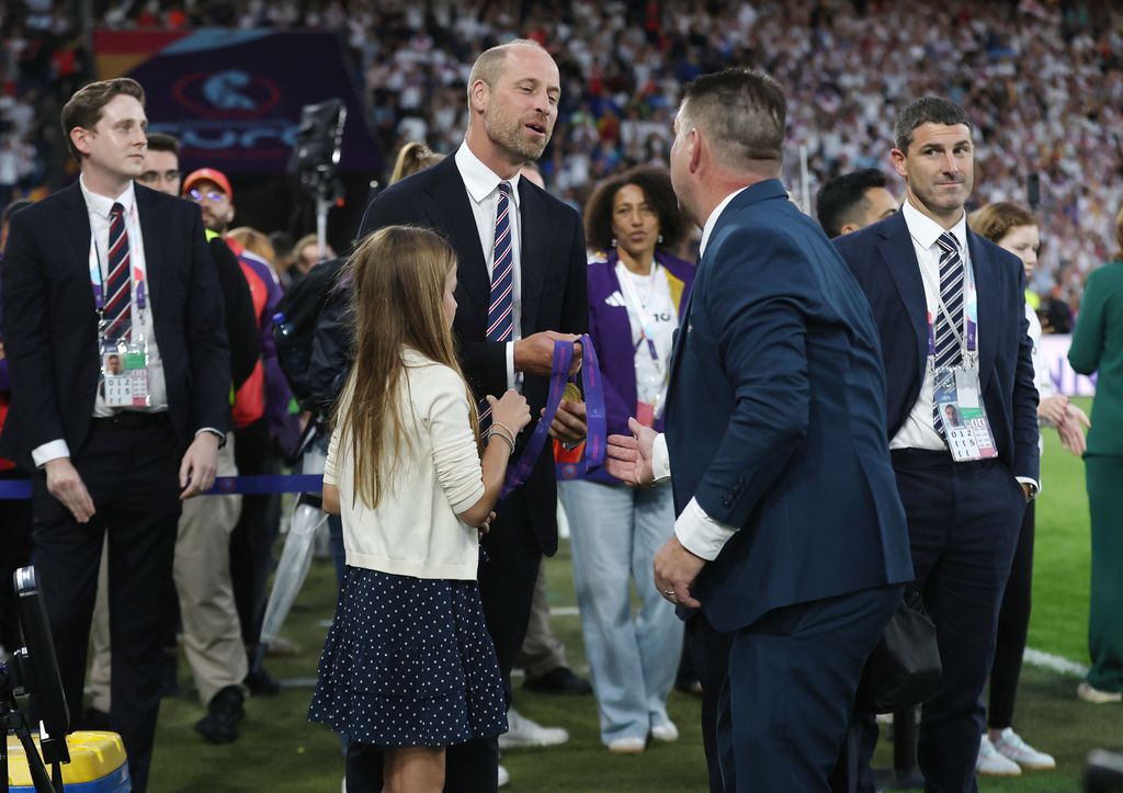 HRH Prince William, Prince Of Wales is handed two UEFA Women's Euro 2025 winners medal's to keep after the presentation along with Princess Charlotte of Wales 