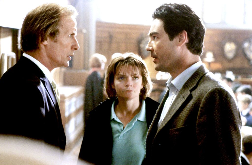 three people talking in school room
