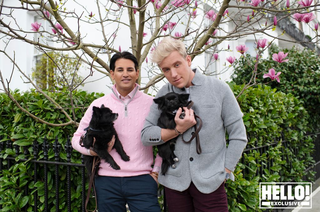 Ollie and Gareth Locke pose outside their Chelsea home with their dogs