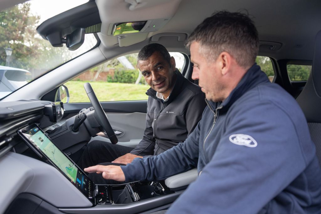 Gareth Herincx getting expert instruction on how to use the infotainment system on the Ford Explorer, which was on the original UKCOTY shortlist