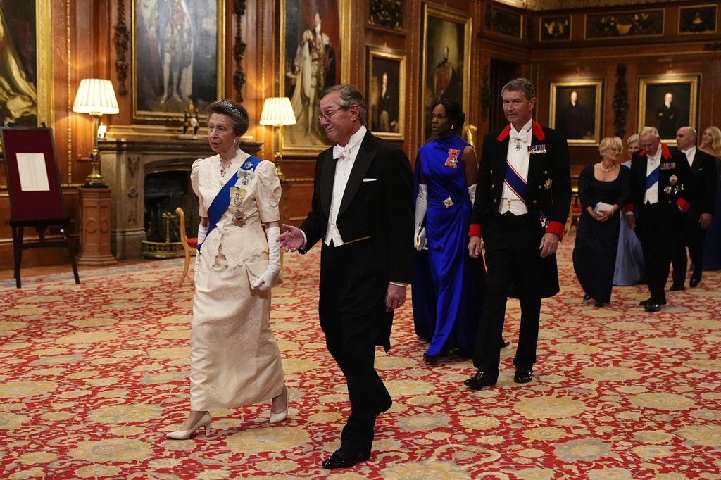 WINDSOR, ENGLAND - SEPTEMBER 17: Princess Anne, Princess Royal walks with US Ambassador to the UK, Warren Stephens, followed by Vice Admiral Sir Tim Laurence and Dame Vivian Hunt, at the state banquet at Windsor Castle, Berkshire, on day one of US President Donald Trump's second state visit to the UK with his wife, First Lady Melania Trump on September 17, 2025 in Windsor, England. President Trump is in England from Sept. 16-18 on his second UK state visit, with the previous one taking place in 2019 during his first presidential term. (Photo by Aaron Chown-WPA Pool/Getty Images)