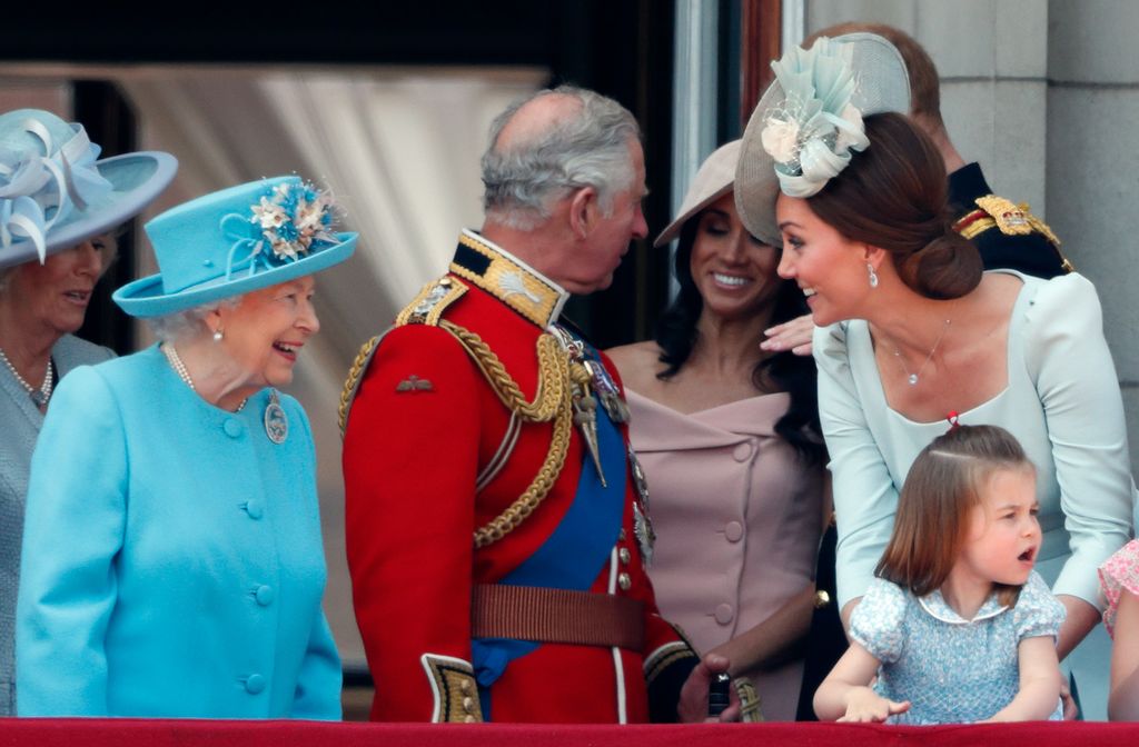 Queen Elizabeth II, Catherine, Duchess of Cambridge and Princess Charlotte of Cambridge stand on the balcony of Buckingham Palace during Trooping The Colour 2018