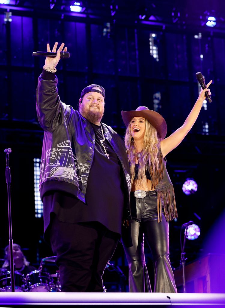 Jelly Roll and Lainey Wilson perform onstage during the 2024 CMA Music festival at the Nissan Stadium