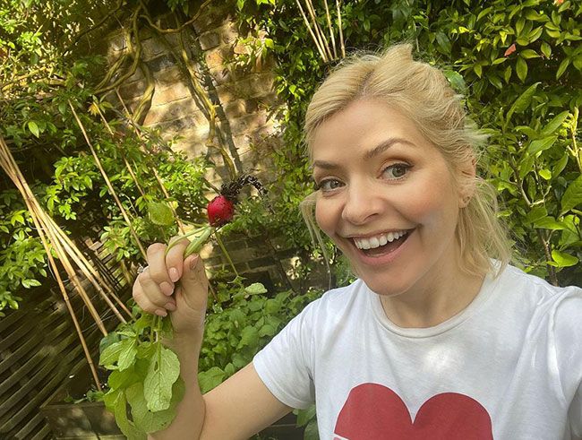 holly willoughby harvests radishes from her garden
