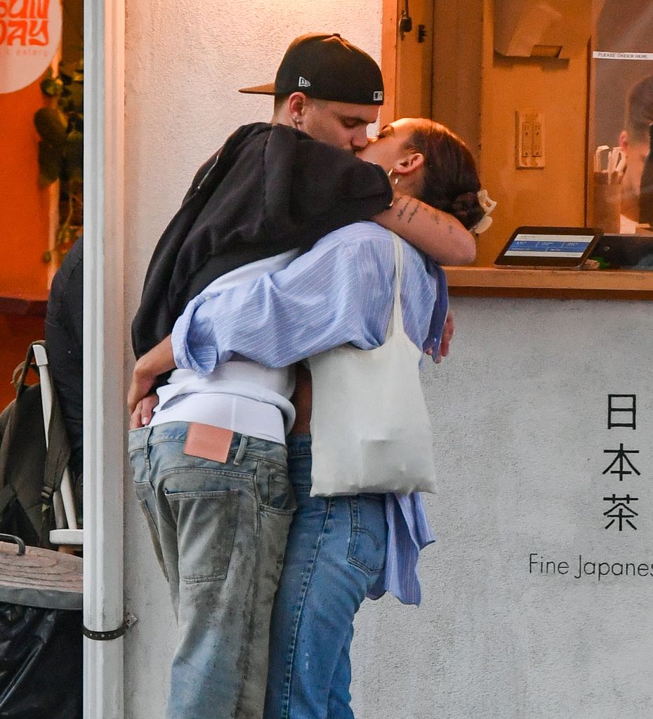 Romeo Beckham and Gray Sorrenti kiss