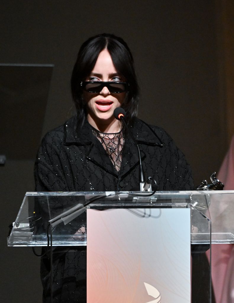 Billie Eilish makes a bold statement with sultry sheer top and chic matching gloves