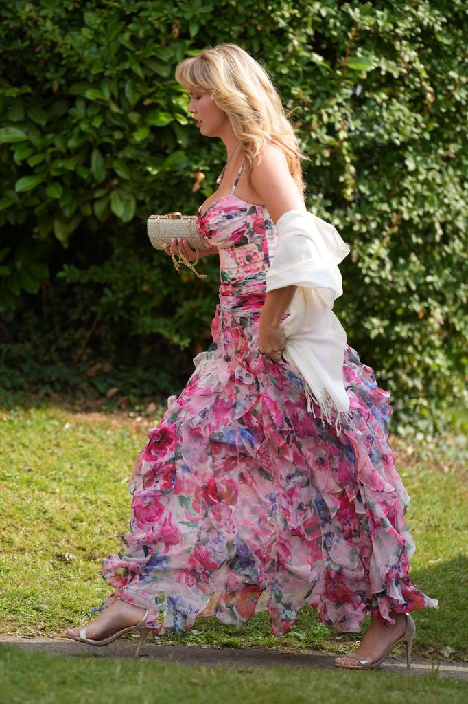 Guests arrive at the wedding of Eve Jobs to Harry Charles at St Michael's and All Angels Church, Great Tew, Oxfordshire, UK, on the 26th July 2025