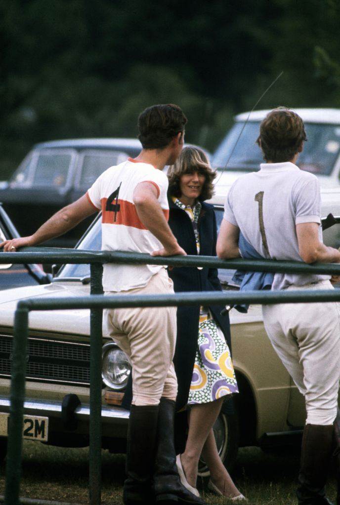 Prince Charles chatting to Camilla at a polo match
