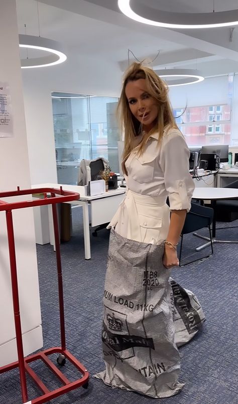 Amanda Holden in a white dress and half a sack