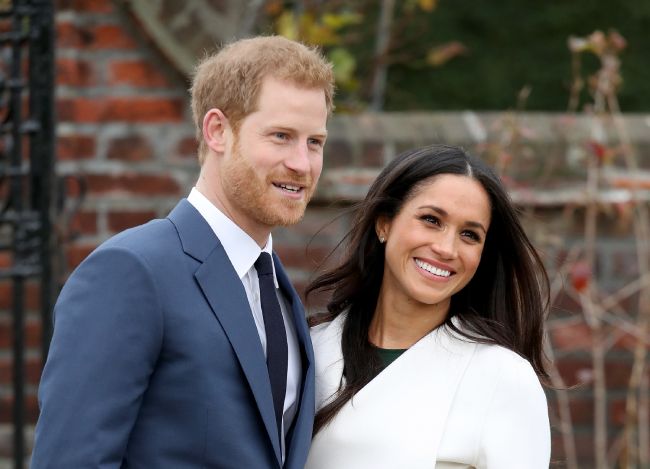 harry and meghan pose on the dayt of their engagement announcement