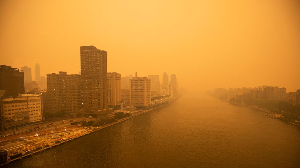 The tramway to Roosevelt Island crosses the East River as smoke from Canadian wildfires casts a haze over the area on June 7, 2023 in New York City. Air pollution alerts were issued across the United States due to smoke from wildfires that have been burni