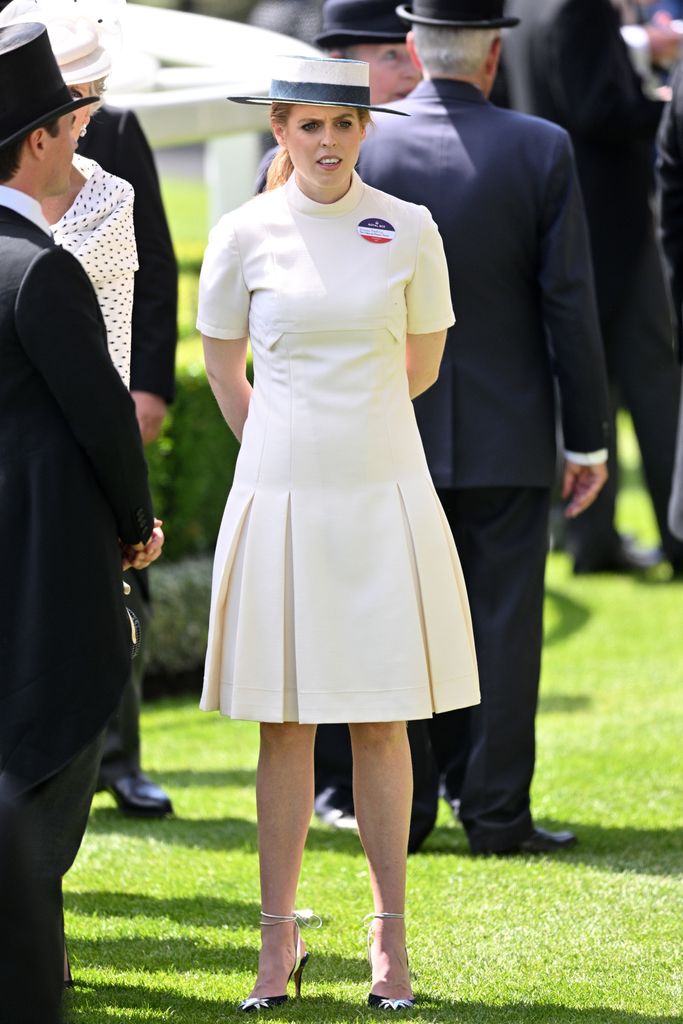 Princess Beatrice in a white dress and blue hat at Royal Ascot 2022 at Ascot Racecourse on June 15, 2022 
