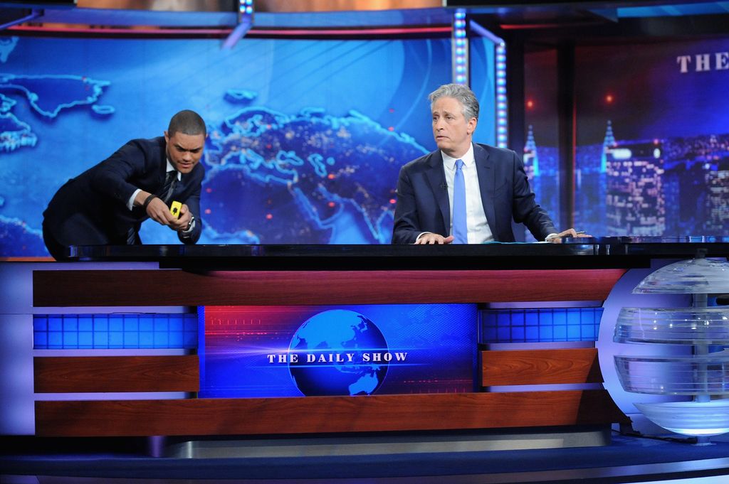 Trevor Noah and host Jon Stewart appear on "The Daily Show with Jon Stewart" #JonVoyage on August 6, 2015 in New York City