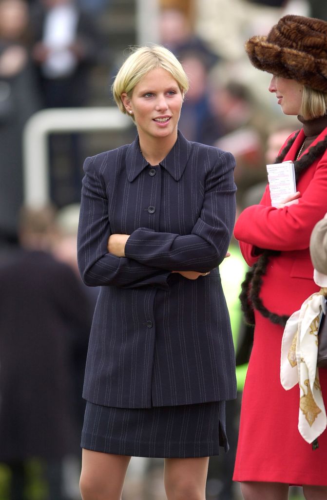 Zara Tindall with her arms crossed in a skirt and jacket