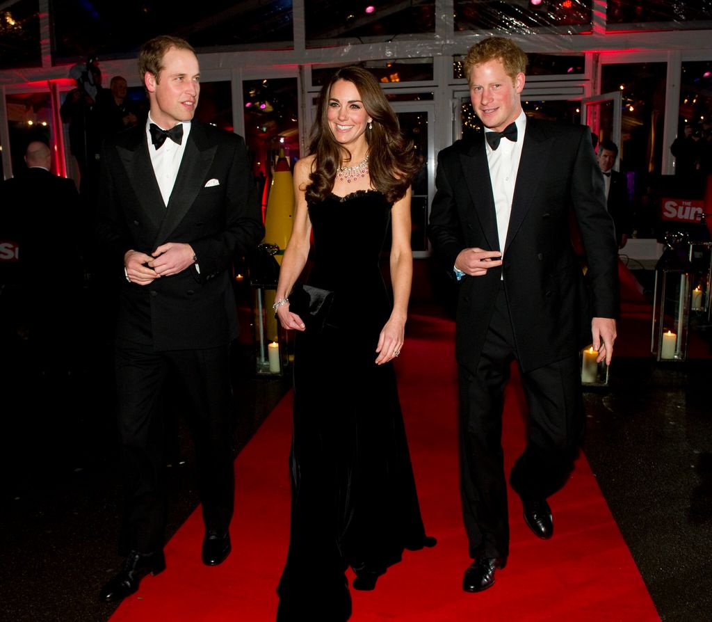 Britain's Prince William, Catherine, Princess of Wales and Prince Harry leave after they attended "A Night of Heros" on 19 December 2011