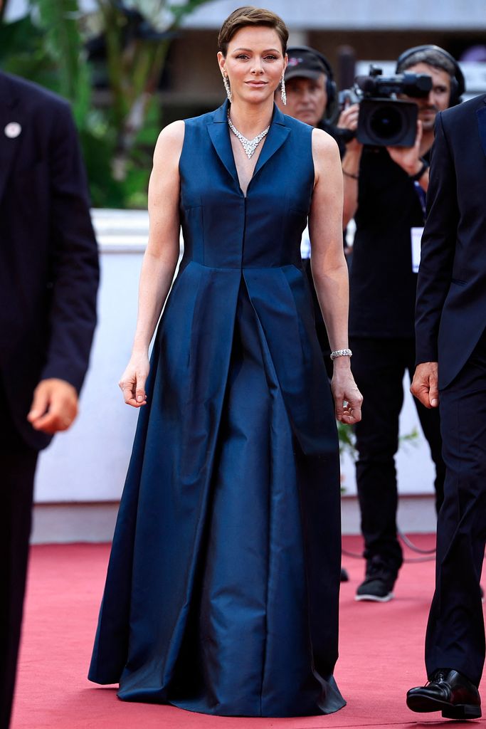 Princess Charlene of Monaco is a total Bond girl in vampy silk dress