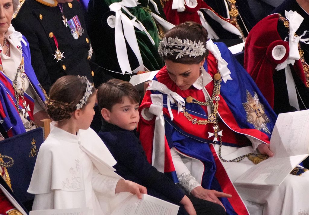 Princess Kate and Princess Charlotte talking to Prince Louis 