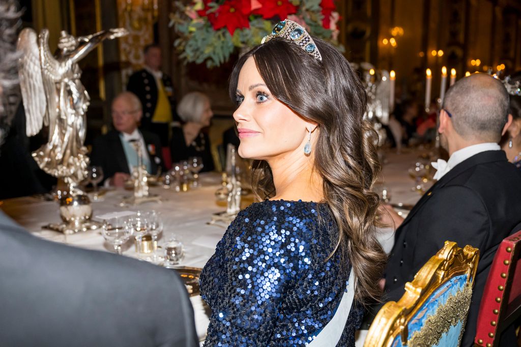 Princess Sofia sat at royal dinner side on in tiara