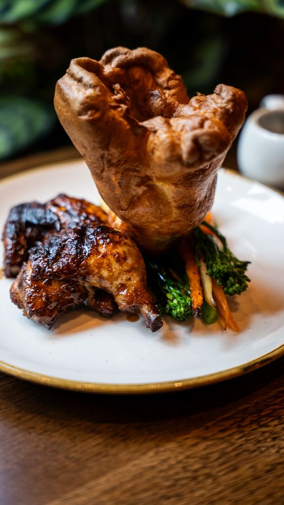 Sunday Roast showing pudding, Jerk Poussin, honey roasted carrots and parnsip