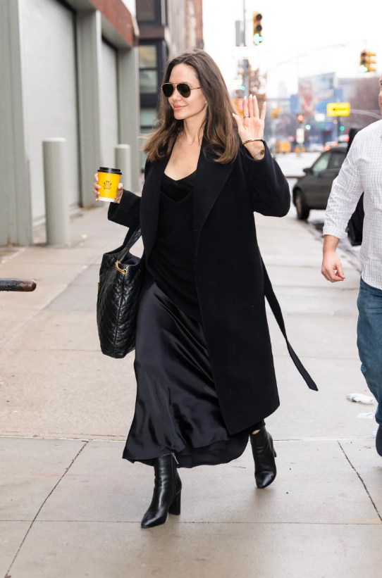 Angelina Jolie wearing a black satin maxi