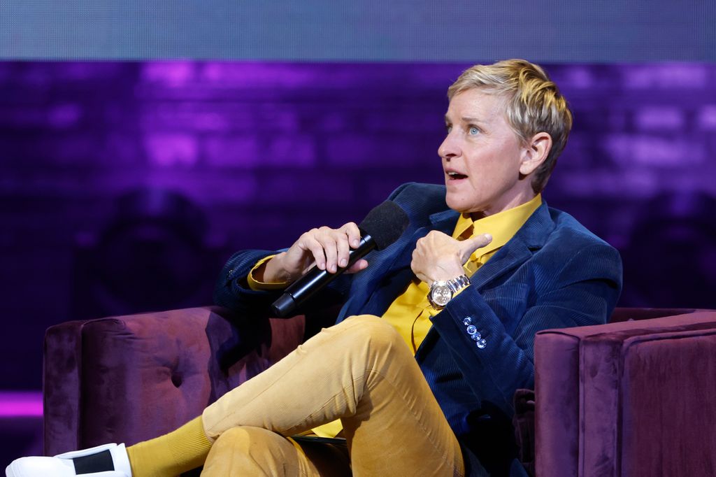 Ellen DeGeneres speaks with a microphone onstage during the Michelle Obama: The Light We Carry Tour at Warner Theatre on November 15, 2022 in Washington, DC