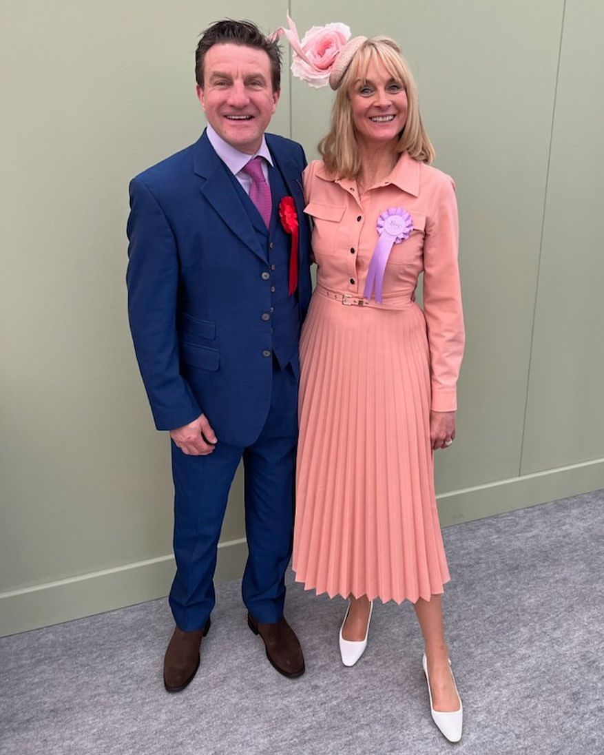 Louise Minchin in a pleated peach dress with her husband David