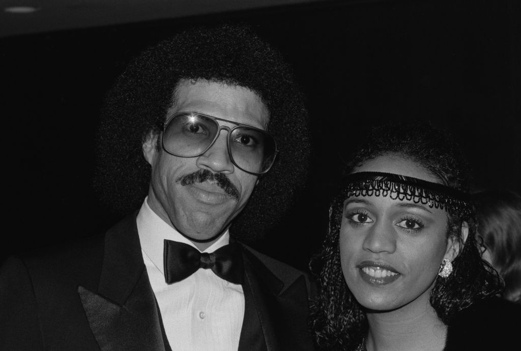 Lionel Richie smiles alongside his wife Brenda Harvey, circa 1983