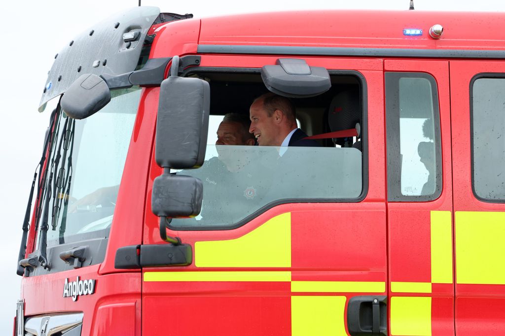 Prince William takes part in a simulated fire response exercise during an official visit at RAF Valley