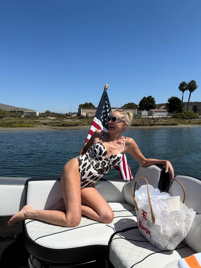 photo of sharon stone wearing animal print swimsuit on a boat