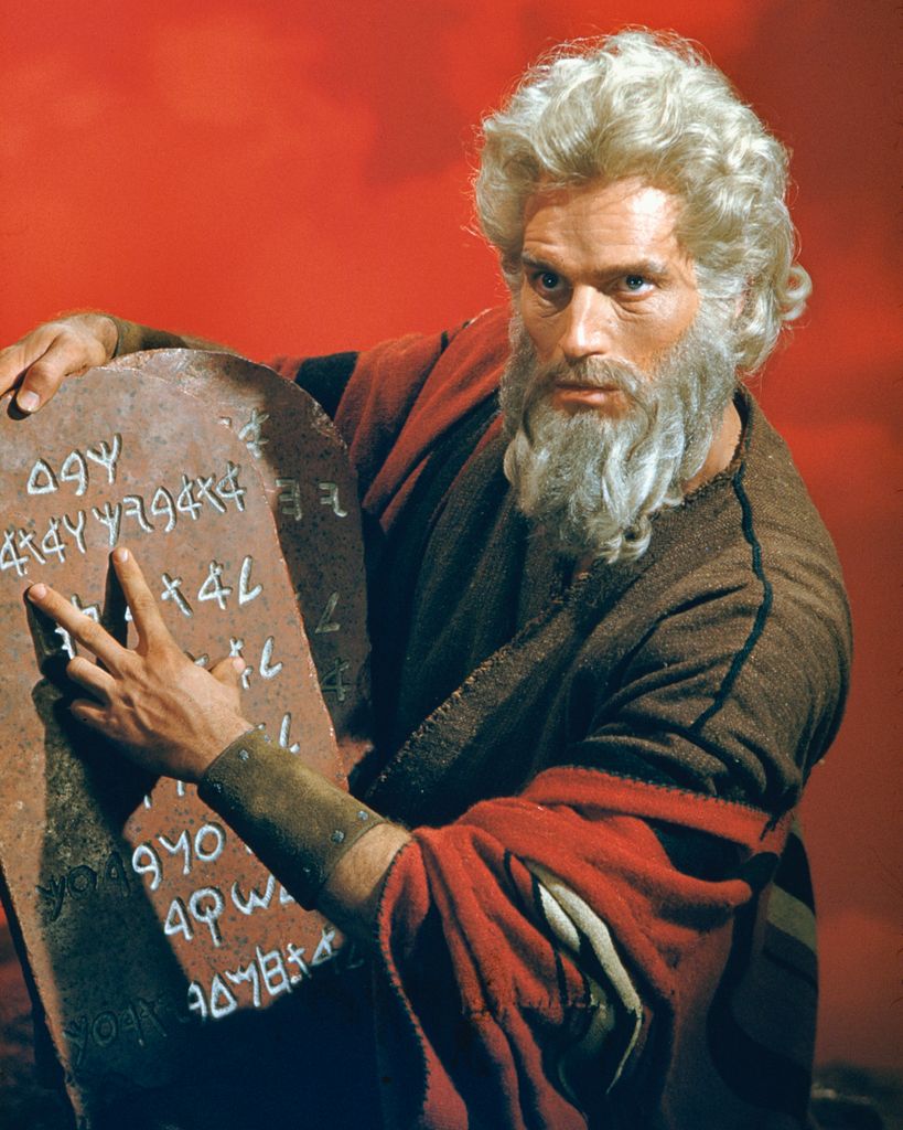American actor Charlton Heston as Moses with the titular stone tablets in the biblical epic 'The Ten Commandments'