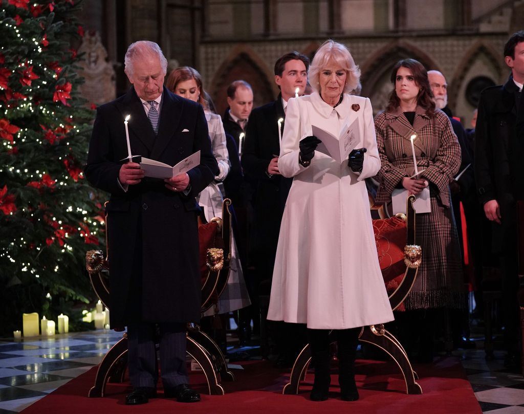 King Charles and Queen Camilla singing carols at christmas