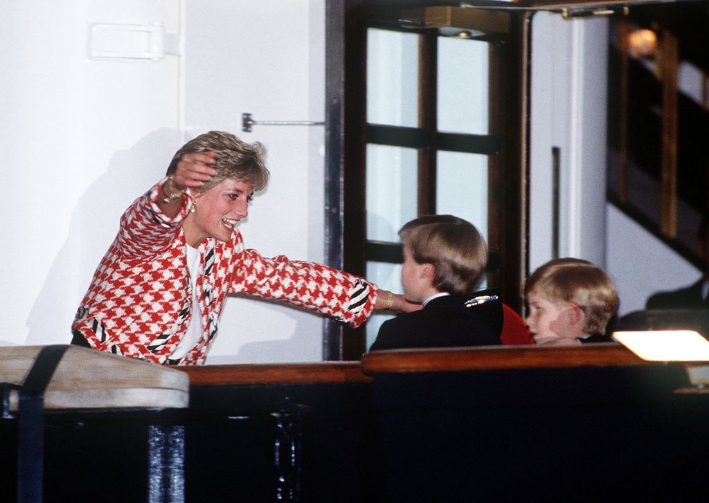 The Princess of Wales greets her sons Prince William and Prince Harry on the deck of the yacht Britannia in Toronto, when they joined their parents on an official visit to Canada