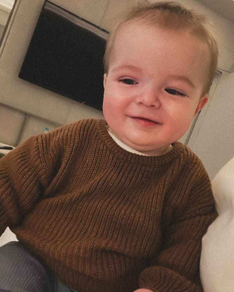 Baby Thiago in brown sweater