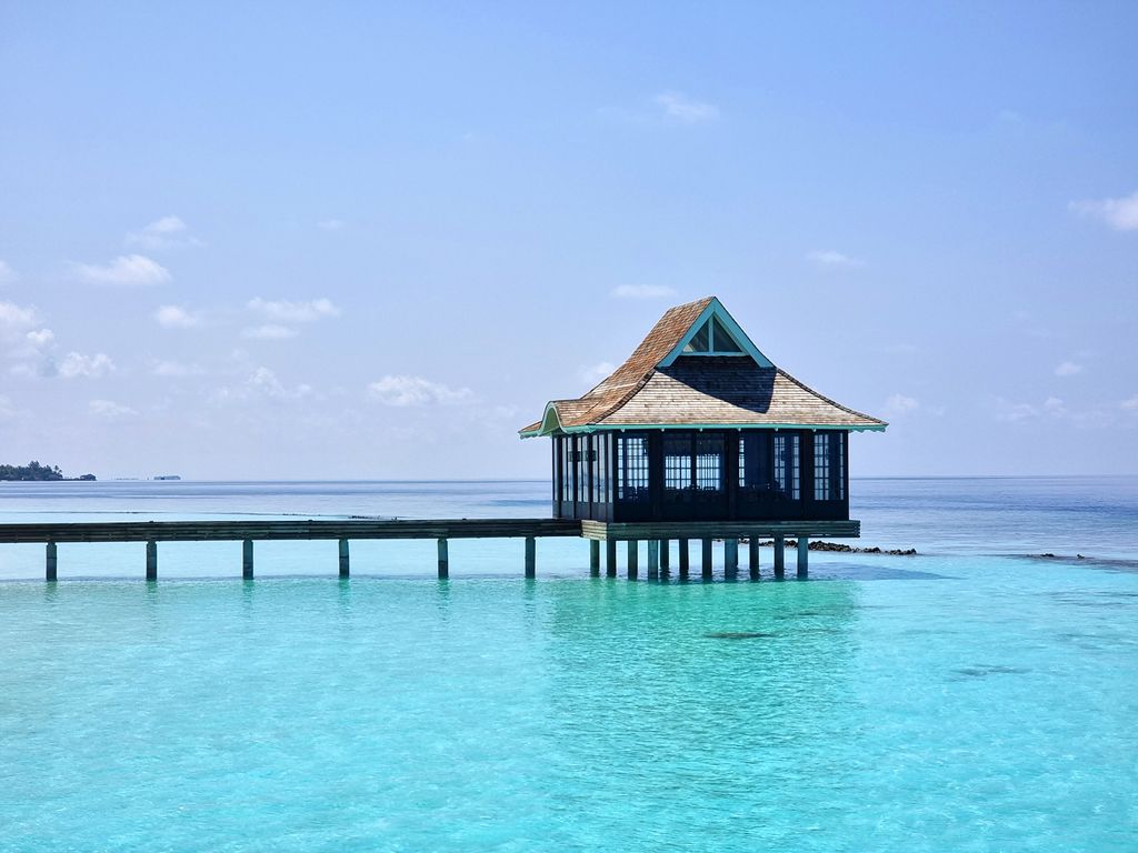 Overwater restaurant appears to be floating on the water at Nova Maldives 