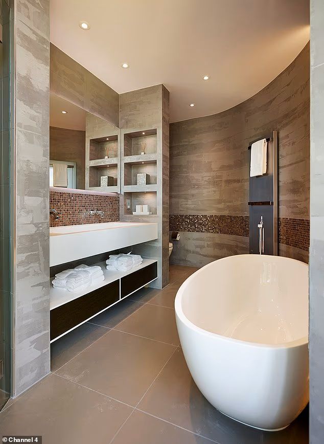 a grey bathroom with tub