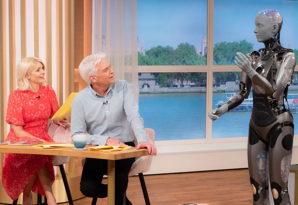 Holly Willoughby and Phillip Schofield looking at a robot